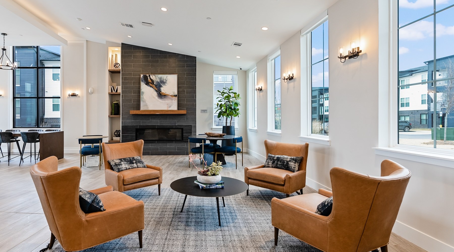 Love where you live clubhouse with leather chairs and a fire place