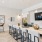 large clubhouse kitchen with seating table and tv