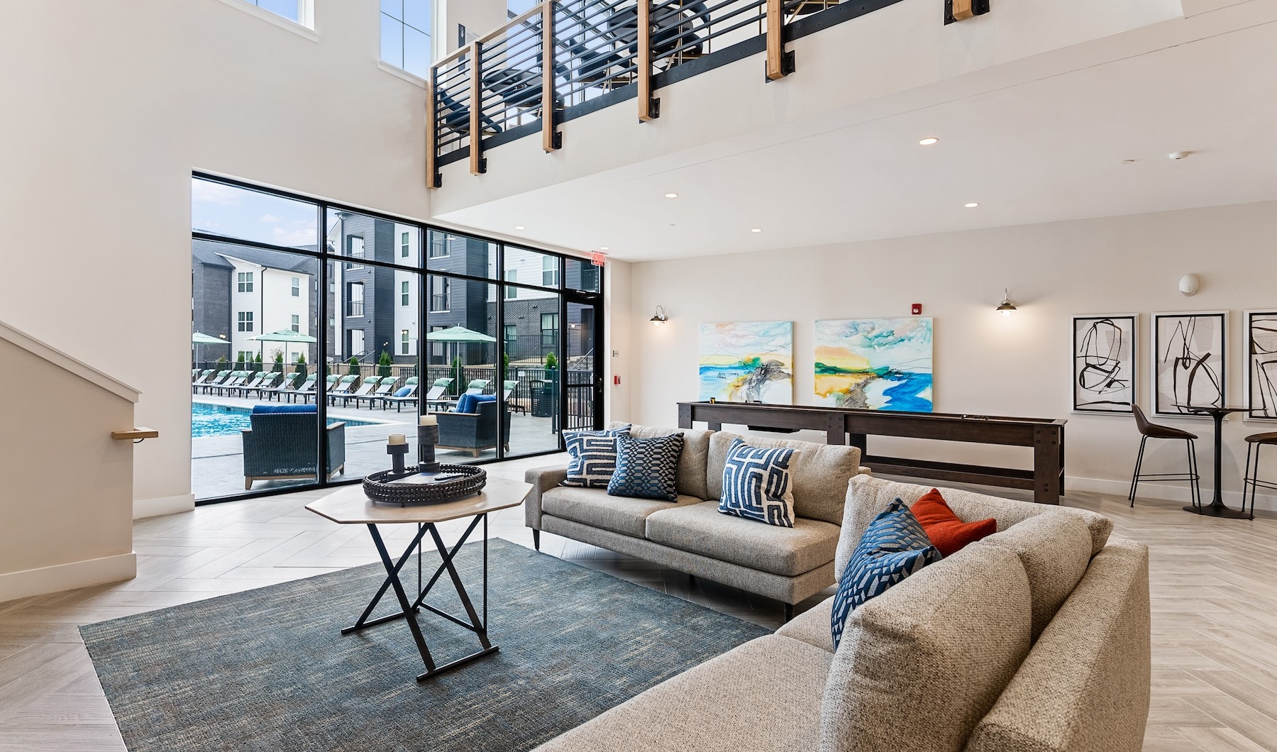 Access to resident only amenities clubhouse with large couch and large windows