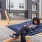 a person sitting in a hammock outside