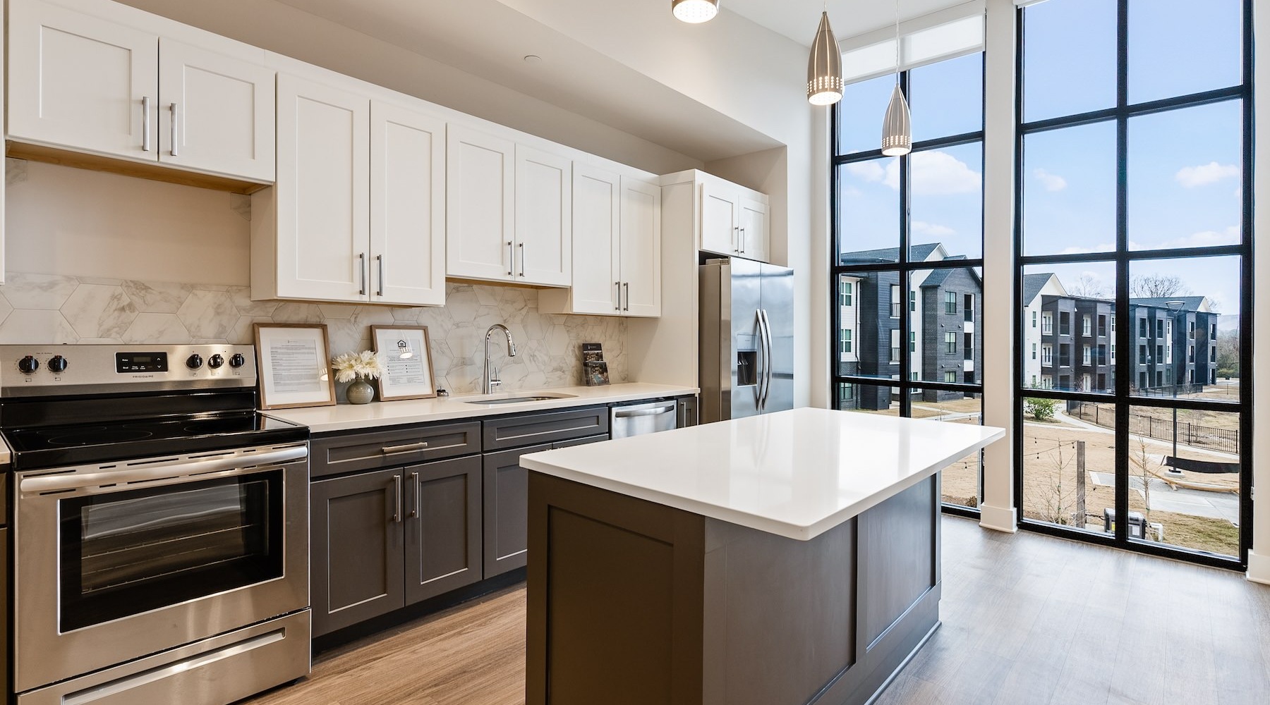 Spacious kitchens with thoughtful details large kitchen with large marble island and large windows