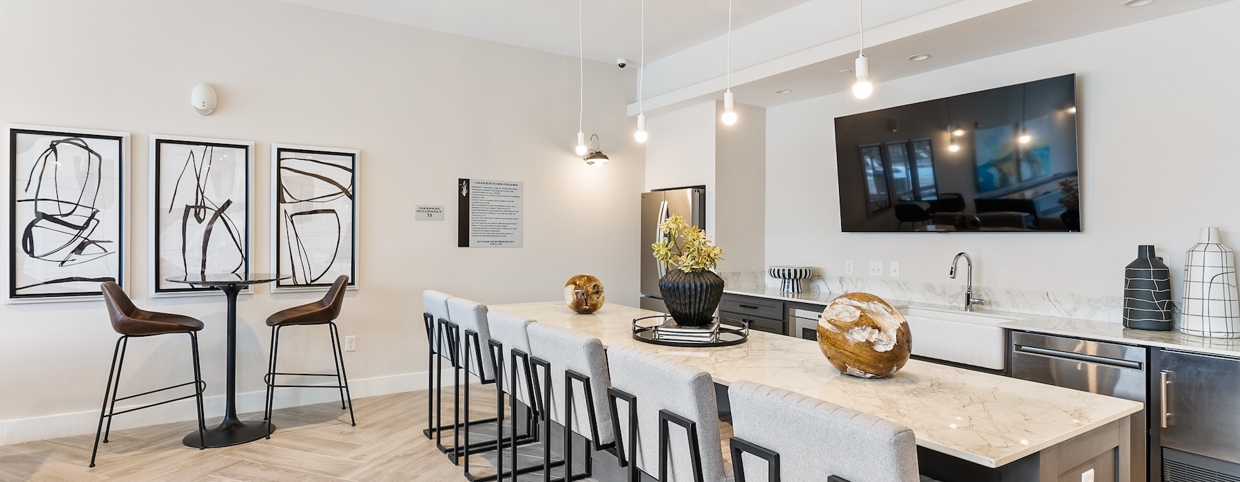 clubhouse kitchen with large island seating and tv